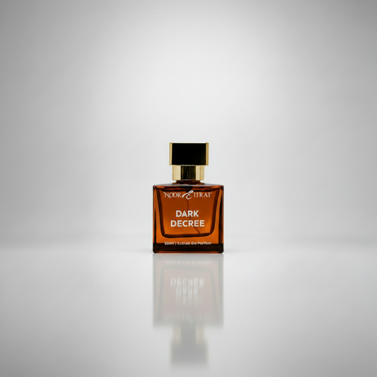 Perfume bottle labeled 'Dark Decree' on a gray background
