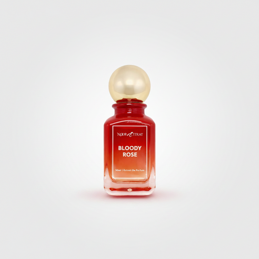 Perfume bottle labeled 'Bloody Rose' by Nour That on a white background
