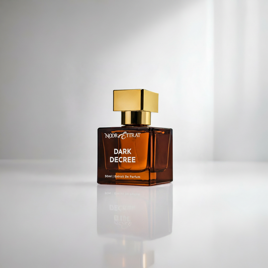 Perfume bottle labeled 'Dark Decree' by Nobile Etrat on a reflective surface with a gray background