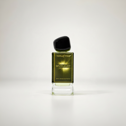 Perfume bottle labeled 'Spotlight' on a white background